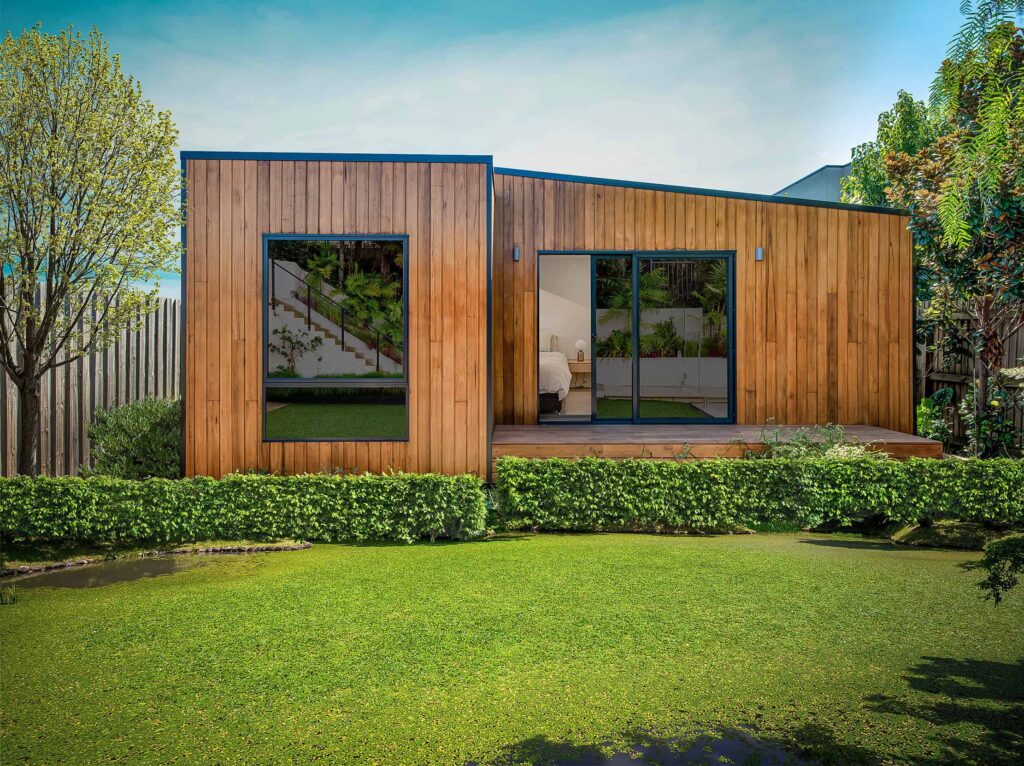 Modular garden studio with timber cladding and sliding glass doors, installed in a residential backyard in Melbourne, Australia.